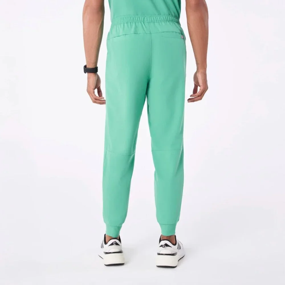 FIGS Men’s Tansen Jogger Scrub Pants in Surgical Green, size M